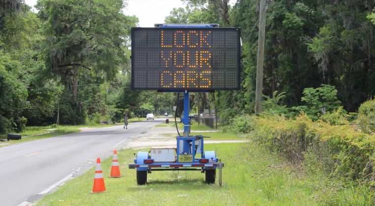 A sign Wednesday afternoon warns residents of a string of car burglaries on Palatka's south side.