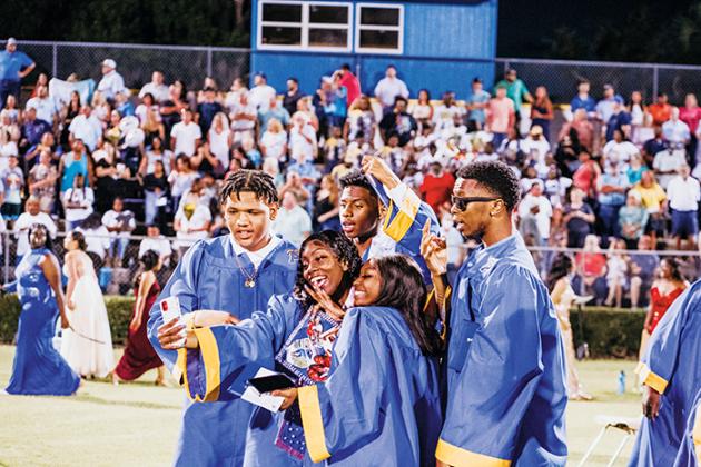 A group of graduates takes a selfie Friday night after the Palatka Junior-Senior High School commencement ceremony.