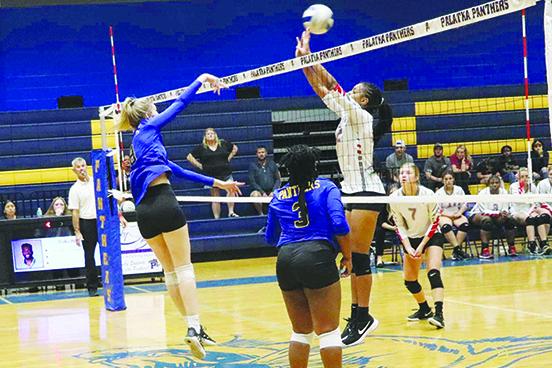 Palatka’s Ava Richardson (left) attempts a spike over Bradford’s Ar’nayshia Griffin during Tuesday’s district semifinal match. (RITA FULLERTON / Special to the Daily News)