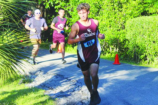 Crescent City’s Jesus Cruz (front) and Norberto Avila (middle) were two of the Raiders’ four runners who finished in the Top 13 in Thursday’s District 3-2A championship meet in Brooksville. The Raiders scored 69 points to finish second in the team competition and advance to the Region 2-2A meet. (MARK BLUMENTHAL / Palatka Daily News)