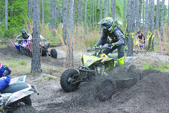 Racers run their ATVs through the dirt during last March’s racing at Hog Waller. (MARK BLUMENTHAL / Palatka Daily News)