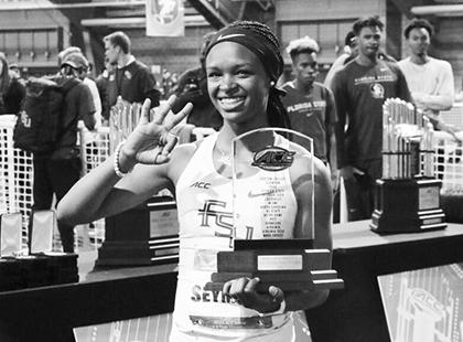 Former Palatka High and Florida State University star track athlete Ka’Tia Seymour holds up three fingers constituting her third ACC Indoor Track Championship Most Outstanding Performer honor on Feb. 29, 2020 at the University of Notre Dame in South Bend, Indiana. (Florida State University file photo)