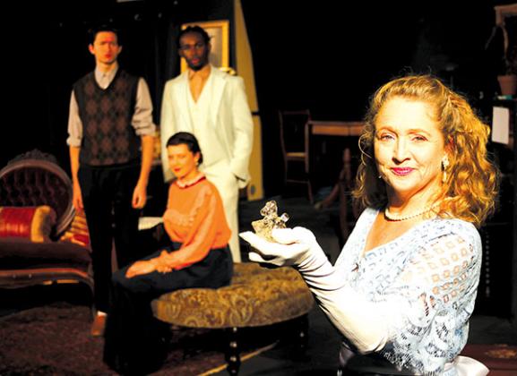 TRISHA MURPHY/Palatka Daily News – VaRonica Spangler, front, holds the glass unicorn while other cast members look on during the River City Players’ rehearsal for “The Glass Menagerie,” which opens Wednesday at the Larimer Arts Center in Palatka.