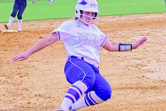 Palatka’s Haleigh Faulkner slides safely into third base during the Putnam County Tournament championship game against Peniel Baptist on April 11. (RITA FULLERTON / Special to the Daily News)