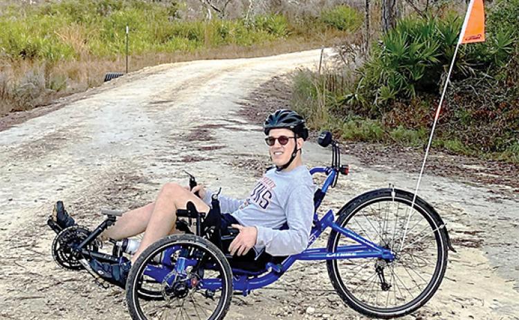 David Steinberg, the son of trail leaders John and Mary Ann Steinberg, tests out the para-gravel ride in the Etoniah Creek State Forest ahead of the 22-mile bicycle ride set for Jan. 22.