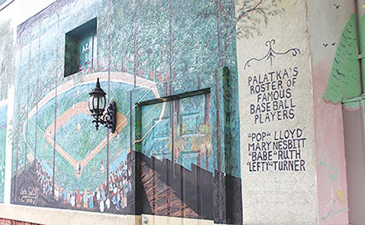 A Palatka mural is dedicated to famous baseball players from Putnam. Baseball plays a large role in this year’s One Book, One Putnam selection.