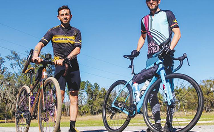 Umberto Arnulfo, left, a St. Augustine cycling tour guide, stands with fellow cyclist Trey Taylor at Coventry Oaks Farm before going for a ride in Putnam County.