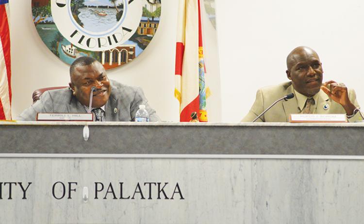 Palatka Mayor Terrill Hill, left, and Commissioner Rufus Borom listen as people discuss city leaders’ relationship with the Palatka Police Department. 