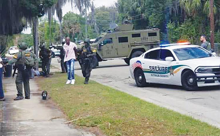 Palatka police officers and SWAT team members arrested 4 following a raid Wednesday at an alleged drug and prostitution den on North 11th Street, authorities said in a statement Thursday. (Palatka Police Department Facebook Page)