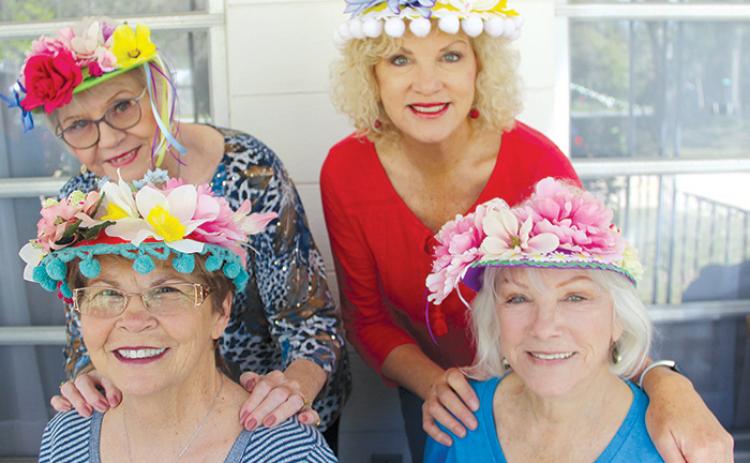 Members of the Welaka Woman’s Club show some of the decorated Easter bonnets that were made Tuesday in preparation for the club’s Spring Market this Saturday.