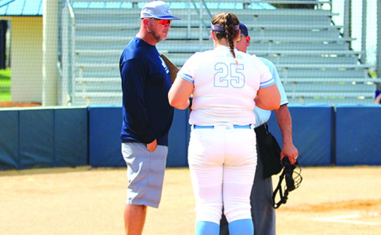 St. Johns River State College softball coach Joey Pound (left) and pitcher Macy Kelley (25) saw their season come to an end in a tough-luck 1-0 loss against Seminole State in the Mid-Florida Conference tournament opening game on Tuesday. (MARK BLUMENTHAL / Palatka Daily News)