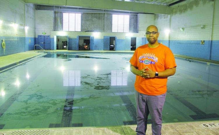 The Rev. Herbert Johnson stands next to the Family Life Center’s pool.