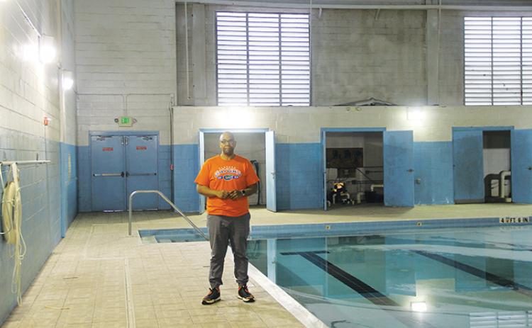 The Rev. Herbert Johnson stands next to the Family Life Center’s pool last month.