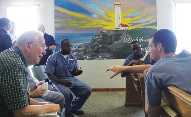 Inmates at Putnam Correctional Institution in East Palatka participate in listening exercises Saturday at an “institutional reunion” for Kairos Prison Ministry.