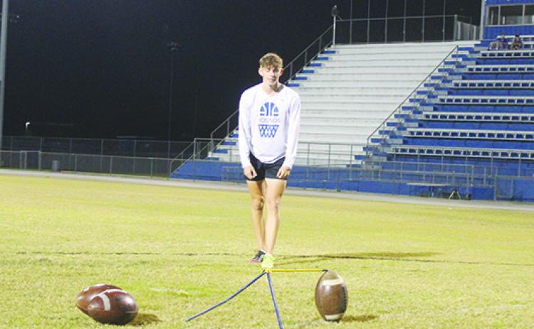 Former Interlachen High School standout kicker Austin Lloyd prepares to make a field-goal attempt during a practice session last November. (MARK BLUMENTHAL / Palatka Daily News)