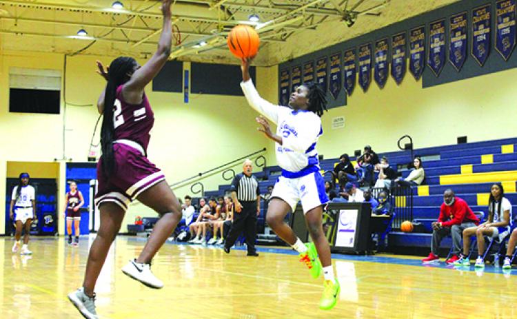 Palatka’s Zy’ria Jones goes up with a shot against St. Augustine High during the Jarvis Williams Christmas Tournament in December. (MARK BLUMENTHAL / Palatka Daily News)