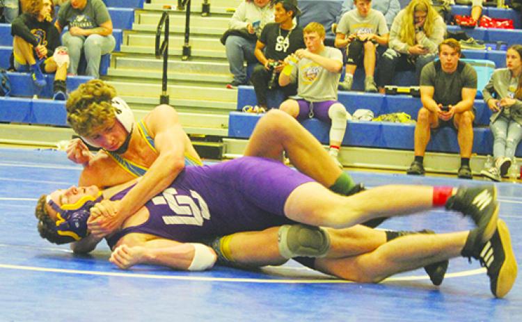 Palatka’s Brandon Lewis is in control in his District 4-1A semifinal match against Union County’s Rodney Barnett in February. Lewis won the match by pin and went on to win the 138-pound district championship. (MARK BLUMENTHAL / Palatka Daily News)