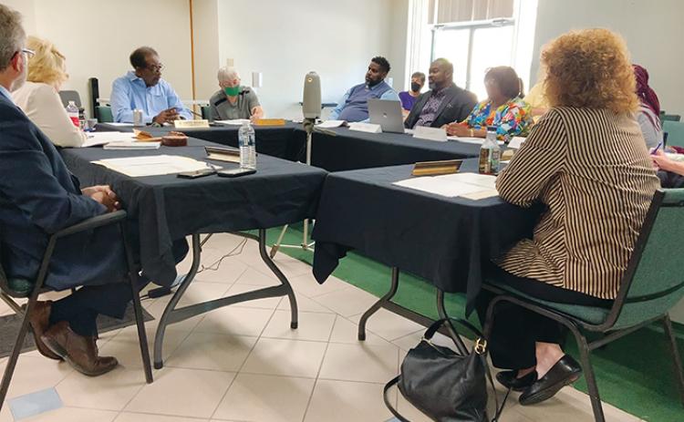 Crescent City commissioners and members of the Concerned Citizens of South Putnam meet in a Tuesday workshop to discuss the group’s proposal to rehabilitate and take ownership of the abandoned former New Moon Lodge building.