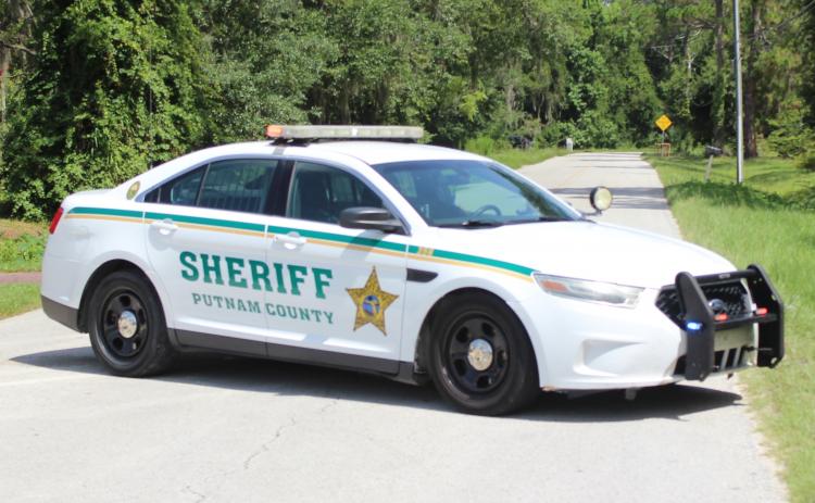 A sheriff's vehicle blocks Putnam County Boulevard at Fulwood Road Tuesday morning amid a standoff that ended in apparent suicide.