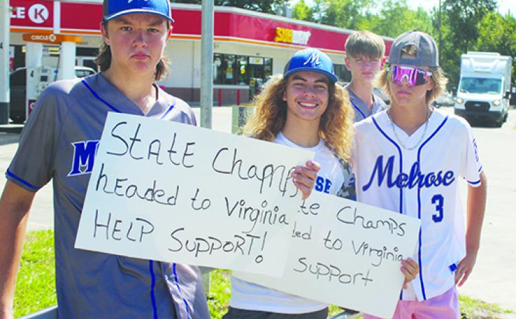 At top, Melrose Babe Ruth 15-and-under all-star baseball players (from left) Gauge Barry, Braden Smyth and Austin Musgrove look for donors to help pay for the team’s trip to the Southeast Regional Tournament in Williamsburg, Virginia, this week. (MARK BLUMENTHAL/ Palatka Daily News) 