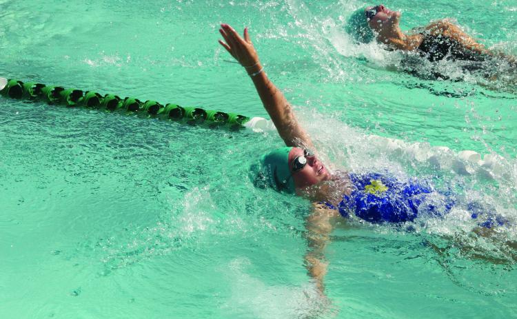 Putnam Sharks swimmer Madelyn Frisvold, seen here competing in the backstroke at a meet at Eagle Harbor, is one of several Sharks being counted on to perform well at the First Coast Summer Swim League championships Friday at Cecil Aquatic Park. (COREY DAVIS/ Palatka Daily News)