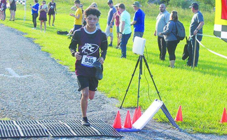 Crescent City's Anthony Vazquez crosses the finish line at the Dwayne Cox Invitational at the West Putnam Recreation Center on Sept. 20. (MARK BLUMENTHAL / Palatka Daily News)