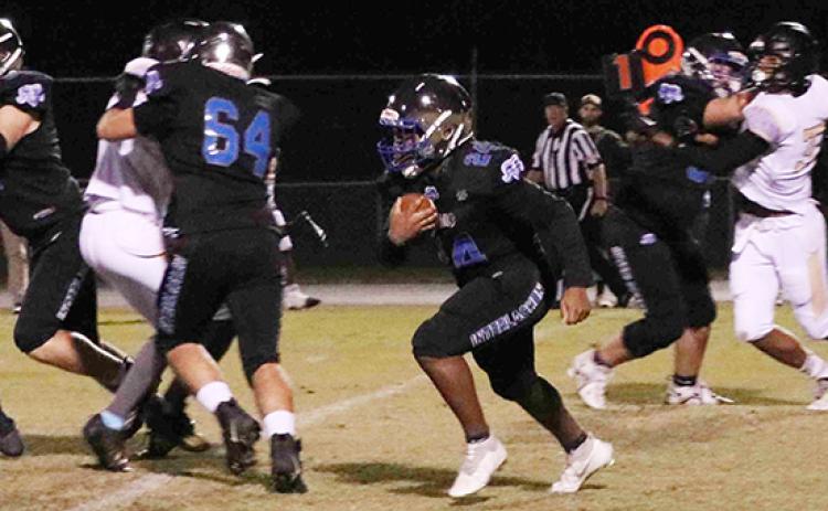 Interlachen’s Kendrick Chaney (24) follows the block of Zack Link for some of his 61 yards rushing in the Rams’ 46-0 victory over Daytona Beach Halifax Academy last Friday. (RITA FULLERTON / Special to the Daily News)