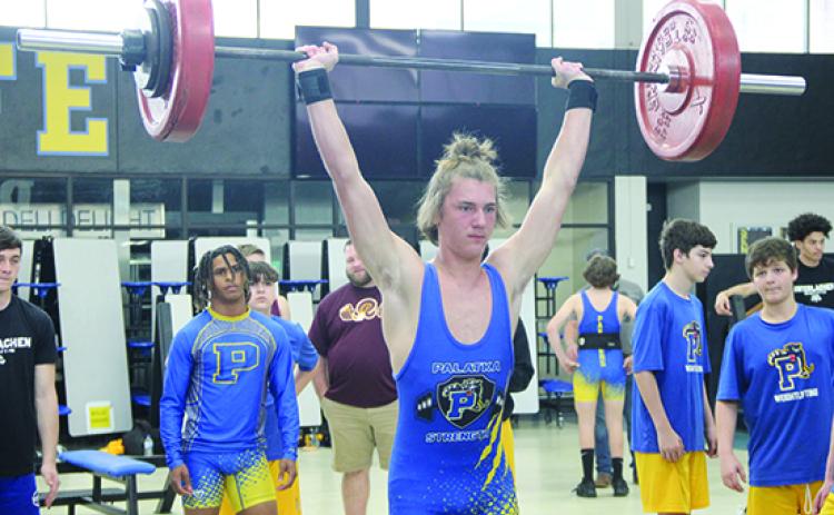 Palatka’s Braxton Anderson finishes a succesful clean-and-jerk attempt in winning the 154-pound county championship. (COREY DAVIS / Palatka Daily News)