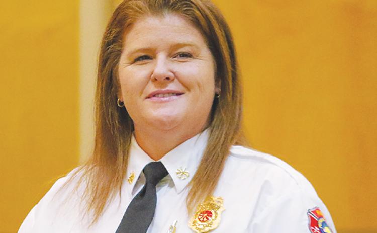 SARAH CAVACINI/Palatka Daily News – Deputy Chief Tina Hitchcock stands to recognize a Putnam County Fire Rescue Department employee during a Board of County Commissioners meeting in November.