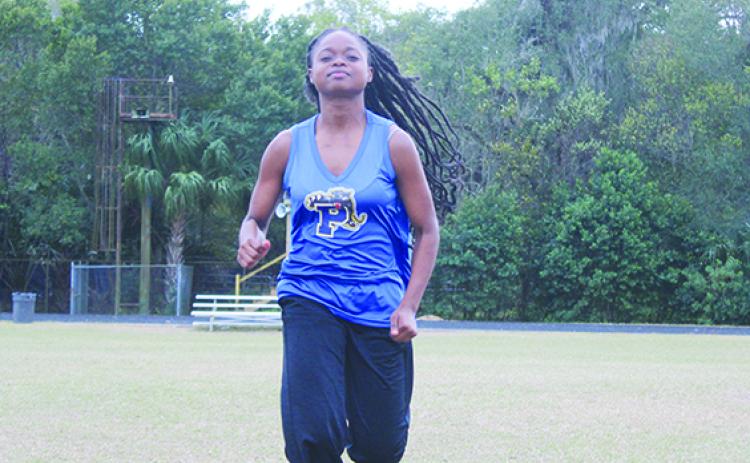 Palatka’s Ymira Passmore became the first girl to win the All-Putnam County cross country title four times. (MARK BLUMENTHAL / Palatka Daily News)