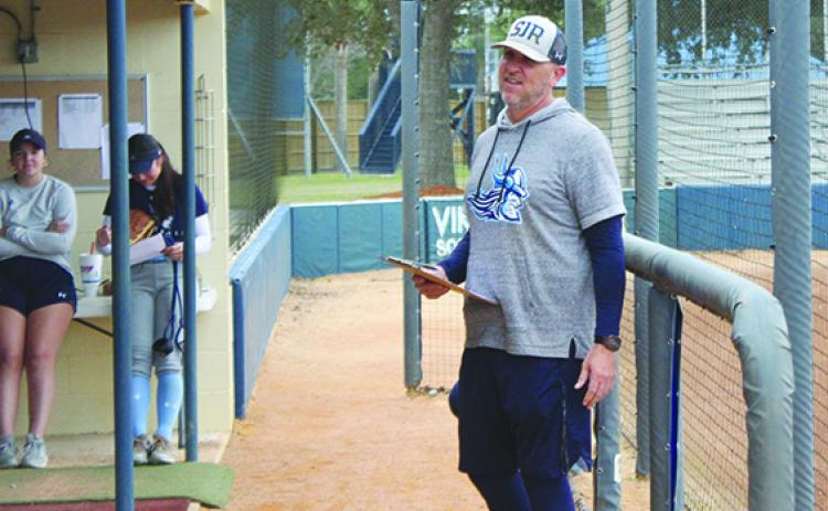 St. Johns River State College softball coach Joey Pound goes over signs with his team during Tuesda’s practice. (MARK BLUMENTHAL / Palatka Daily News)
