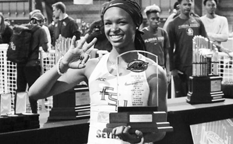 Former Palatka High and Florida State University star track athlete Ka’Tia Seymour holds up three fingers constituting her third ACC Indoor Track Championship Most Outstanding Performer honor on Feb. 29, 2020 at the University of Notre Dame in South Bend, Indiana. (Florida State University file photo)