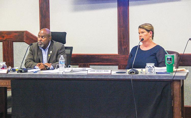 SARAH CAVACINI/Palatka Daily News – Palatka City Manager Troy Bell and City Attorney Jane West sit next to each other during the April 11 Palatka City Commission meeting.