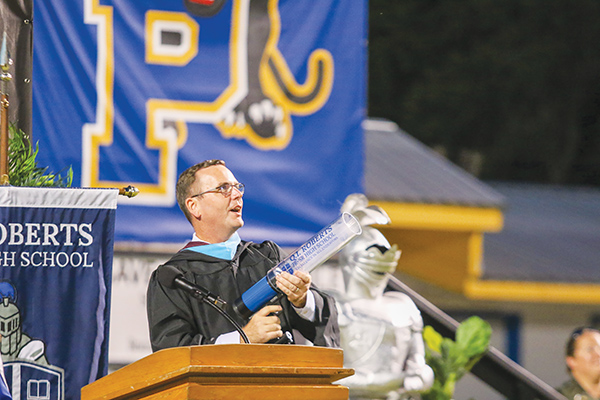 SARAH CAVACINI/Palatka Daily News – Principal Joe Theobold revels in the excitement of shooting the first T-shirt from the launcher graduates gifted him.