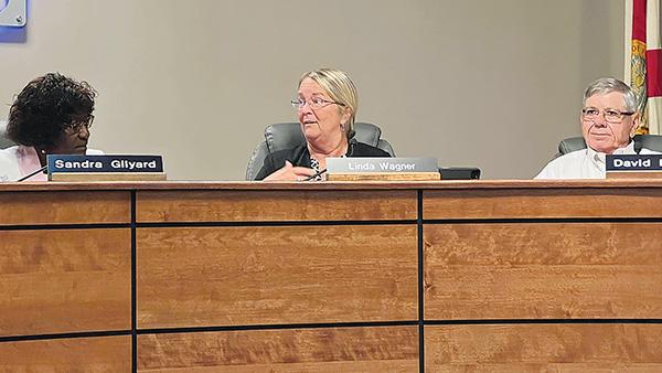 CARTER MUDGETT/Palatka Daily News – Putnam County School Board member Linda Wagner, center, talks to the board Tuesday.  