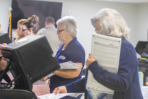 File photo – A group of election volunteers test voting machines ahead of early voting in 2020 at the Supervisor of Elections Office in Palatka.